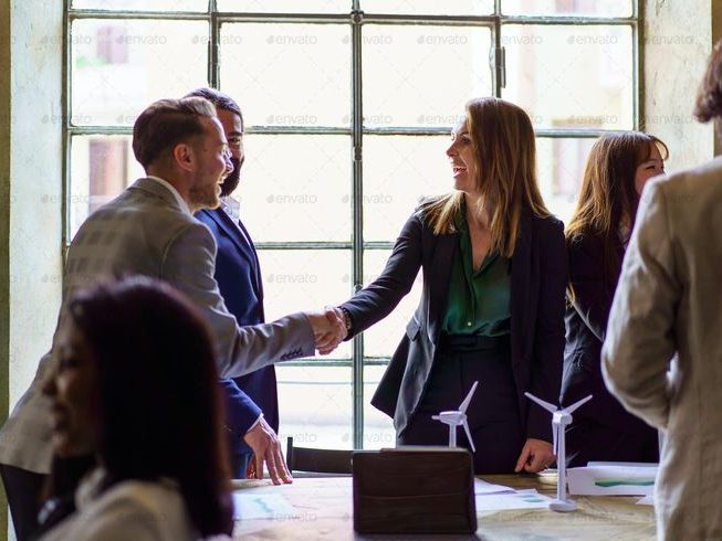 business professionals greeting with a handshake (1) business professionals greeting with a handshake (1)